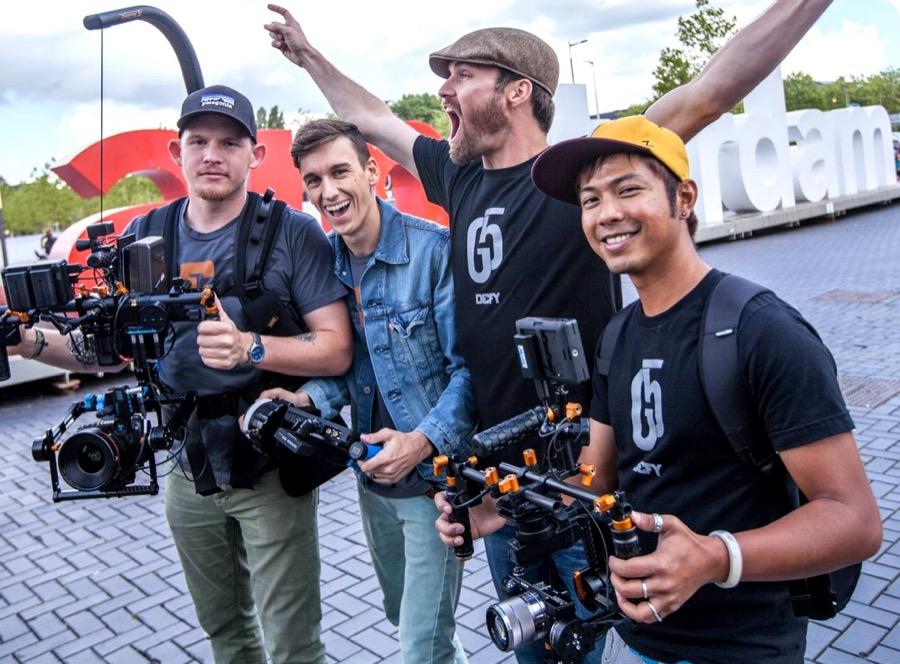 ShareGrid members handing over a camera package